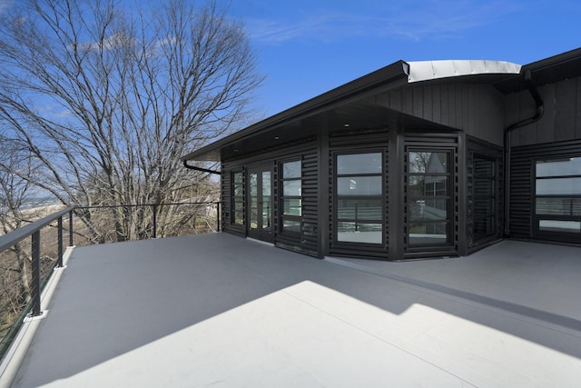 view of home's exterior with a balcony