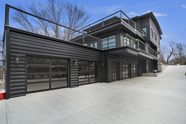 view of side of home featuring a balcony