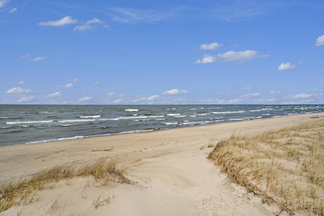 view of water feature with a beach view