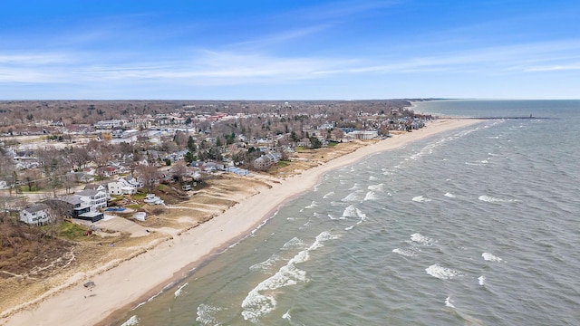 birds eye view of property with a view of the beach and a water view