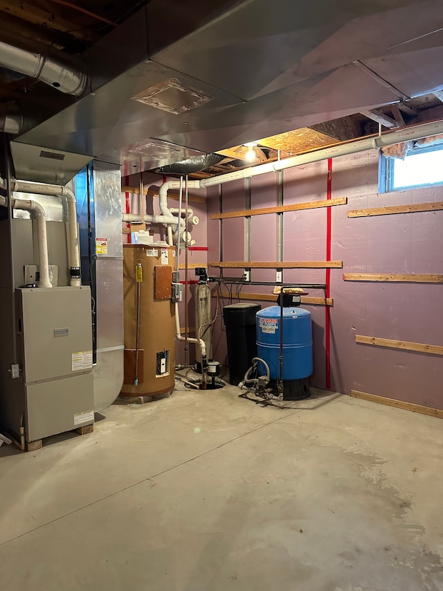 utility room featuring water heater and heating unit