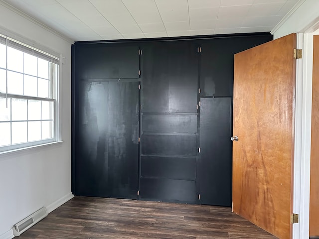 closet featuring a baseboard heating unit