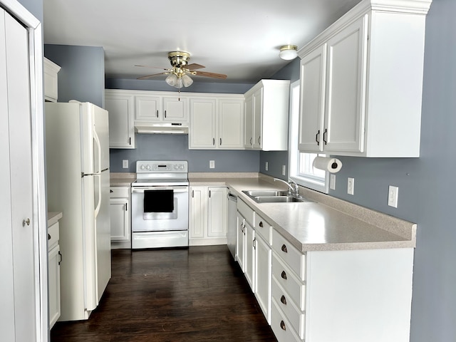 kitchen with sink, white appliances, and white cabinetry