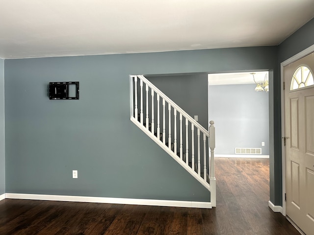 foyer with dark wood-type flooring