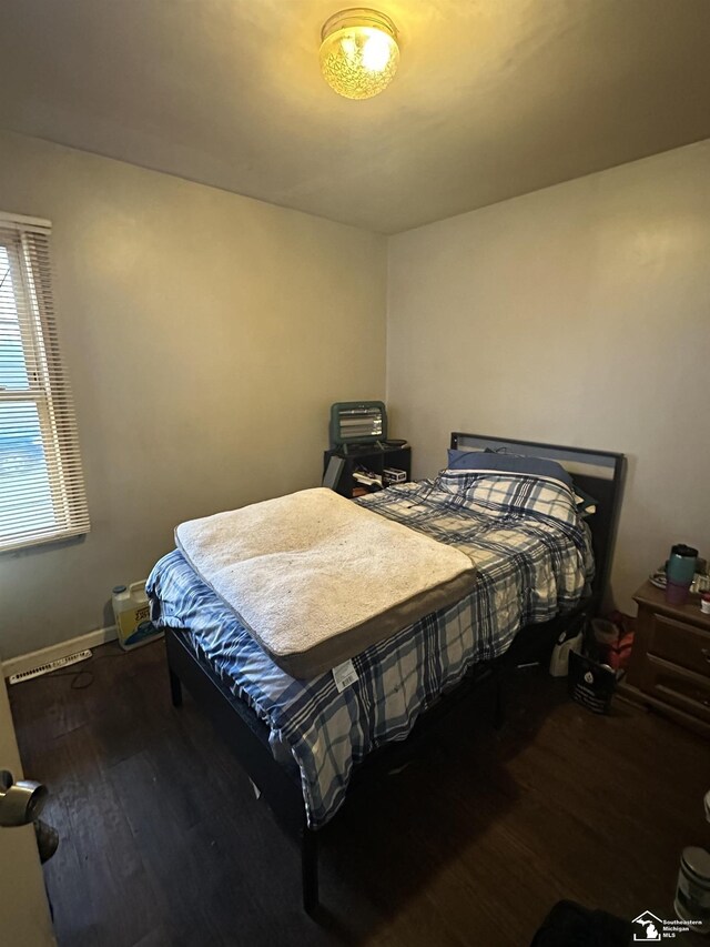 bedroom with hardwood / wood-style flooring