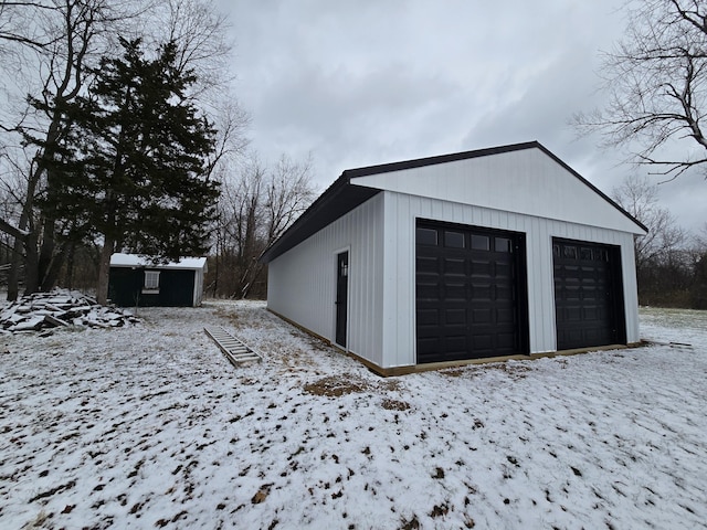 view of snow covered garage