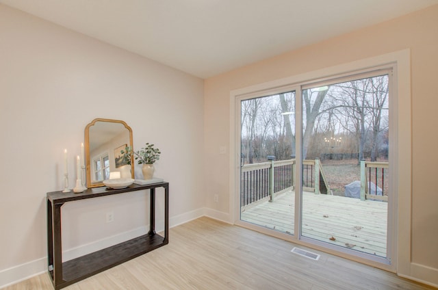 doorway to outside with hardwood / wood-style flooring