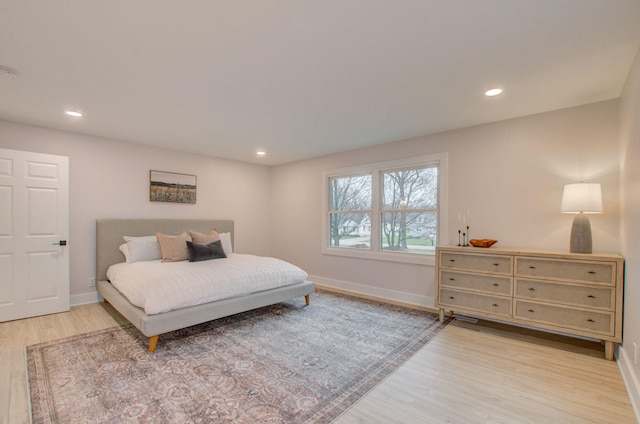 bedroom with light hardwood / wood-style floors