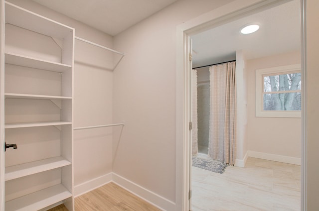 walk in closet featuring light wood-type flooring