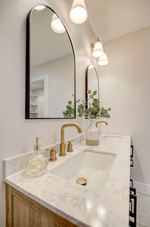 bathroom with vanity and tile patterned floors