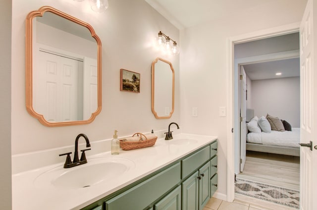 bathroom with tile patterned floors and vanity