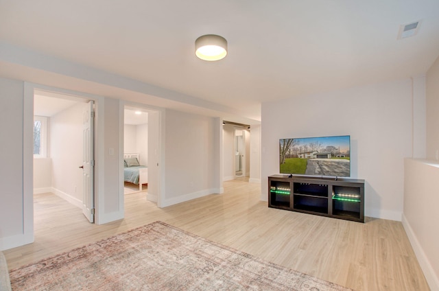 living room with light hardwood / wood-style flooring