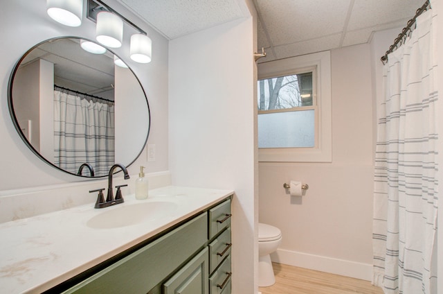 bathroom featuring hardwood / wood-style floors, vanity, and toilet