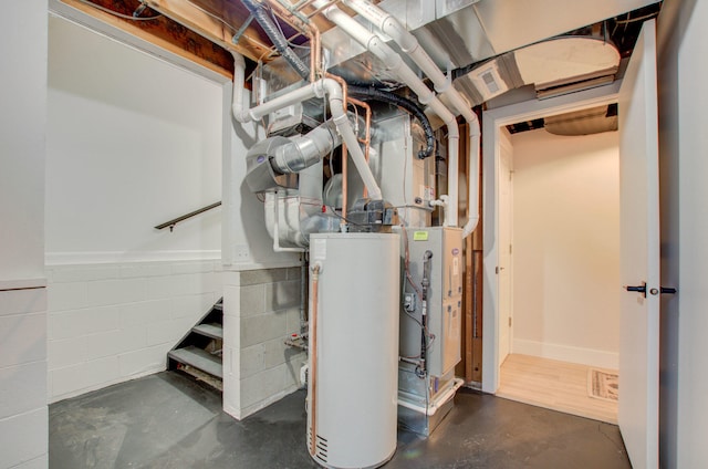 utility room featuring gas water heater