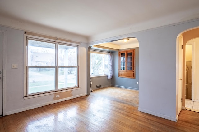 spare room featuring light hardwood / wood-style flooring