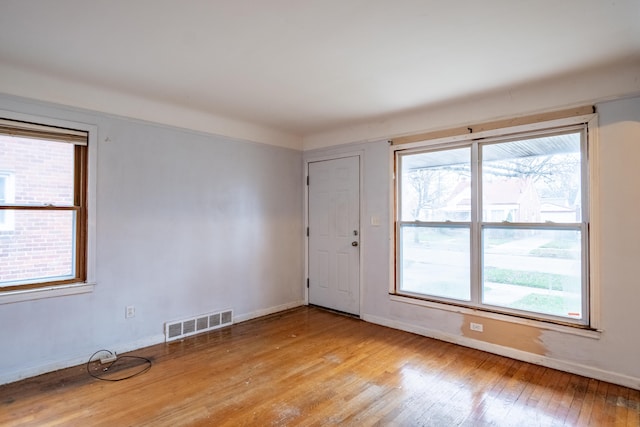 spare room featuring light hardwood / wood-style flooring