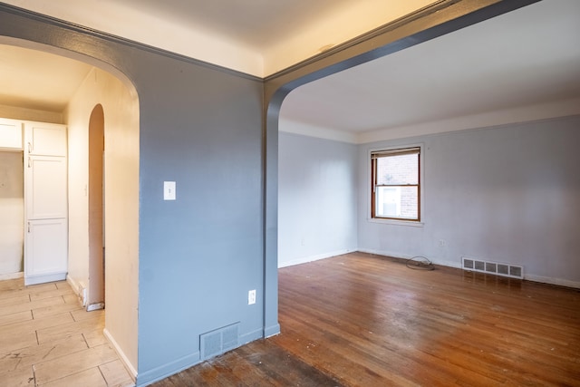 unfurnished room featuring light hardwood / wood-style floors