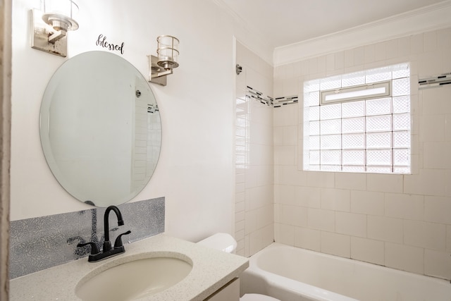 full bathroom featuring tiled shower / bath combo, toilet, ornamental molding, and vanity