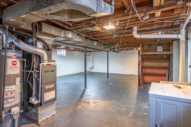 basement featuring washer / dryer, gas water heater, and heating unit