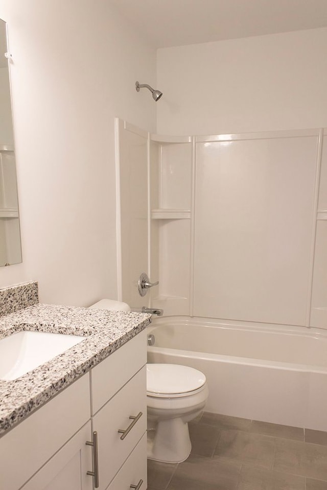 full bathroom with tile patterned floors, shower / tub combination, toilet, and vanity