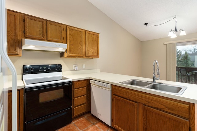 kitchen with kitchen peninsula, white appliances, sink, an inviting chandelier, and hanging light fixtures