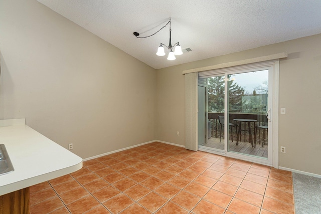 unfurnished dining area with lofted ceiling, tile patterned flooring, a chandelier, and a textured ceiling