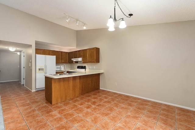 4980 Oak Hill Dr Unit 66, Waterford, MI 48329 - kitchen featuring white refrigerator with ice dispenser, under cabinet range hood, a peninsula, range, and light tile patterned floors