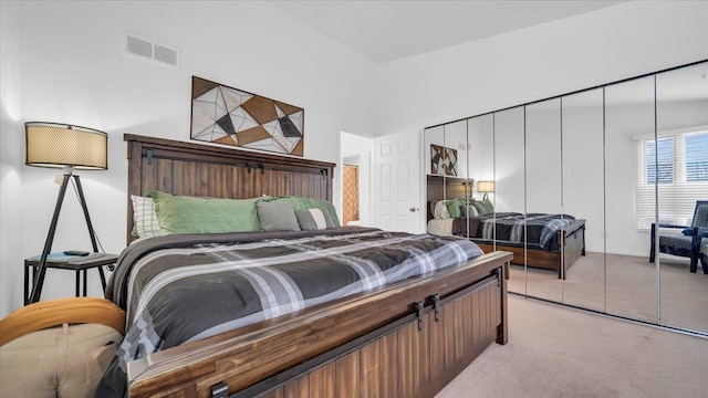 carpeted bedroom featuring a closet