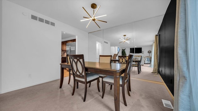 dining space featuring a notable chandelier