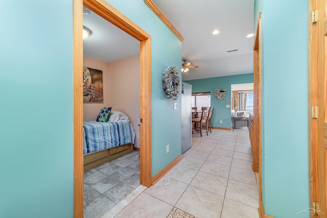 hallway featuring light tile patterned floors