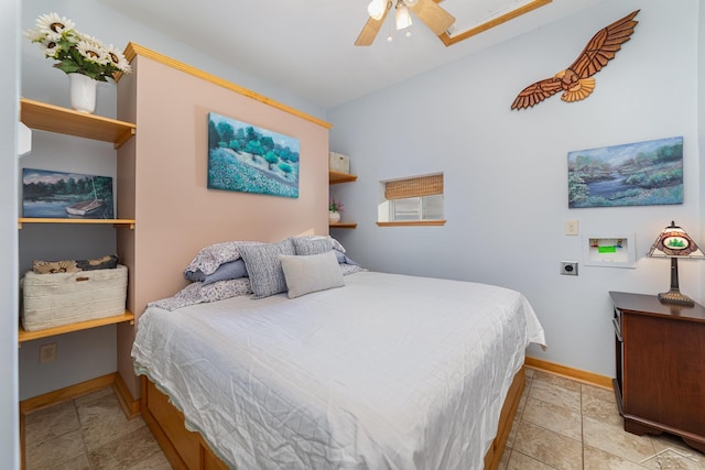 tiled bedroom featuring ceiling fan