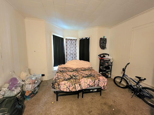 bedroom featuring carpet floors and crown molding