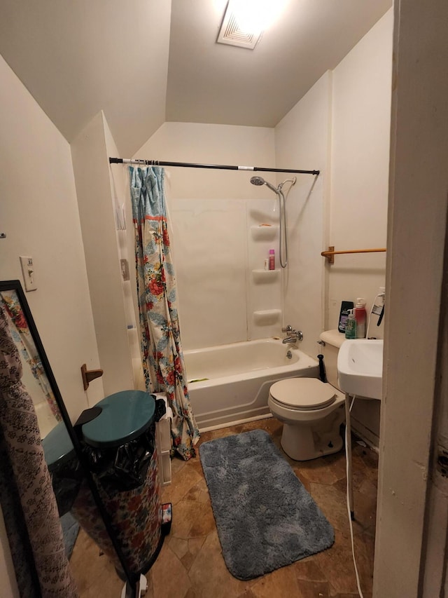 full bathroom with toilet, shower / bathtub combination with curtain, lofted ceiling, and sink