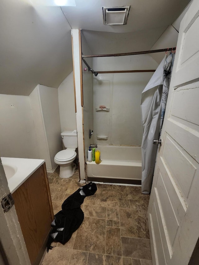 full bathroom featuring vanity, shower / bath combo, and toilet