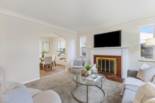 11059 Lakepointe St, Detroit, MI 48224 - living room with hardwood / wood-style floors, ornamental molding, and a brick fireplace