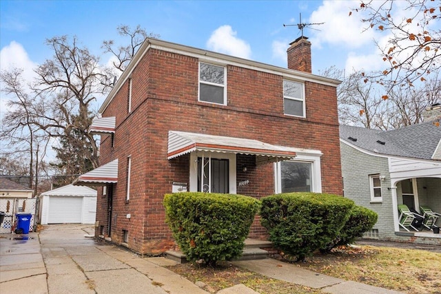 11059 Lakepointe St, Detroit, MI 48224 - view of front facade with a garage and an outdoor structure