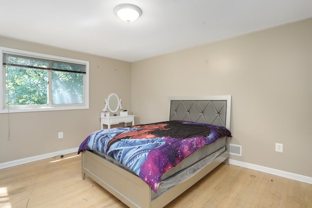 bedroom with light hardwood / wood-style flooring