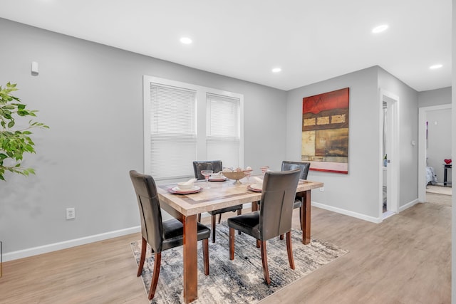 dining room with light hardwood / wood-style flooring