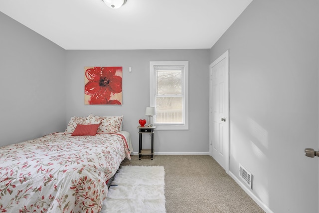 bedroom with light colored carpet