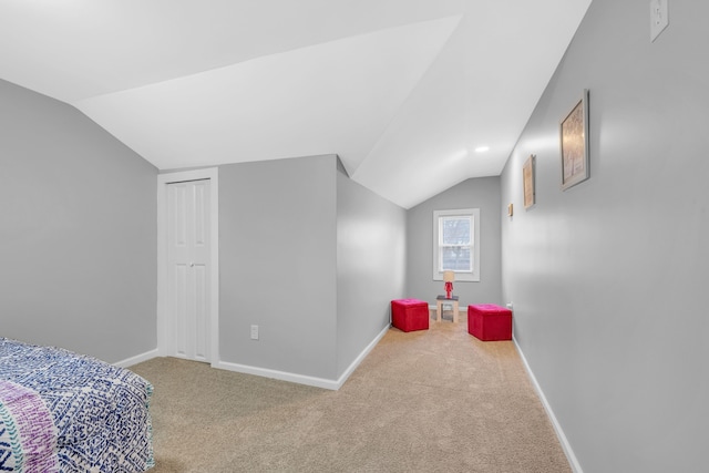 bedroom featuring carpet floors and lofted ceiling