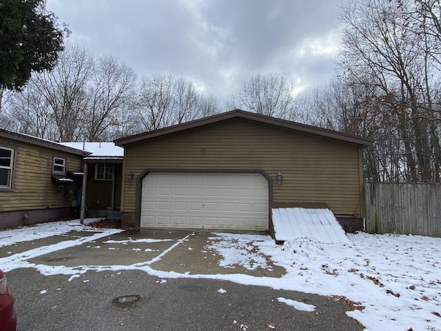 view of snow covered garage