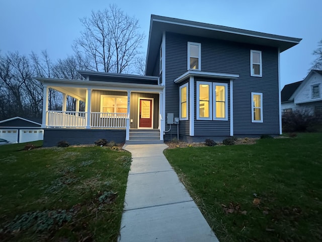 view of front of home with a porch and a front lawn