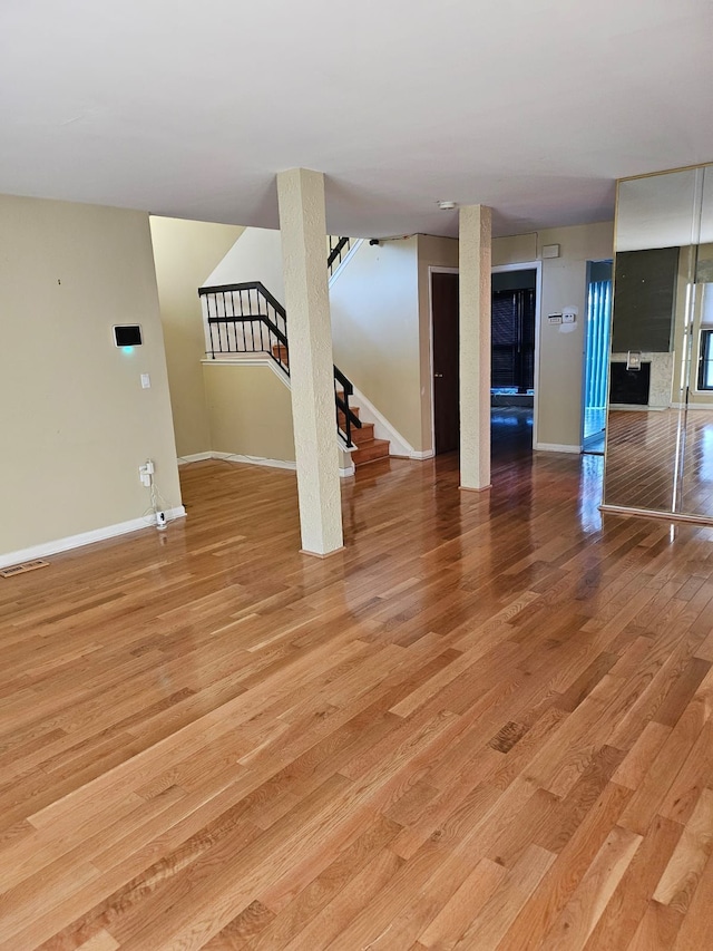 unfurnished living room with light hardwood / wood-style floors