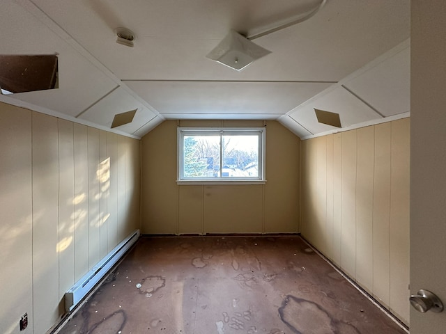 bonus room with wooden walls, baseboard heating, and lofted ceiling