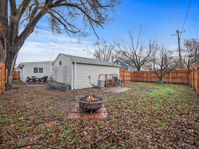 view of yard with an outdoor fire pit