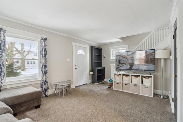 carpeted living room featuring crown molding and plenty of natural light