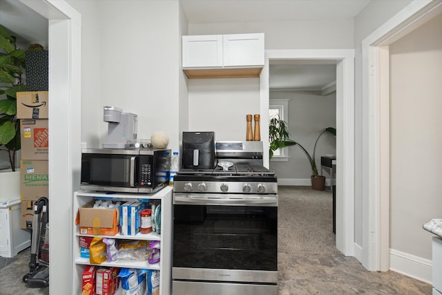 kitchen featuring white cabinets and appliances with stainless steel finishes