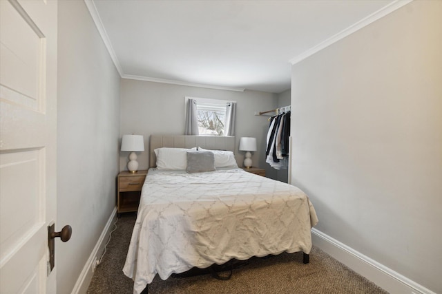 bedroom with crown molding and dark carpet