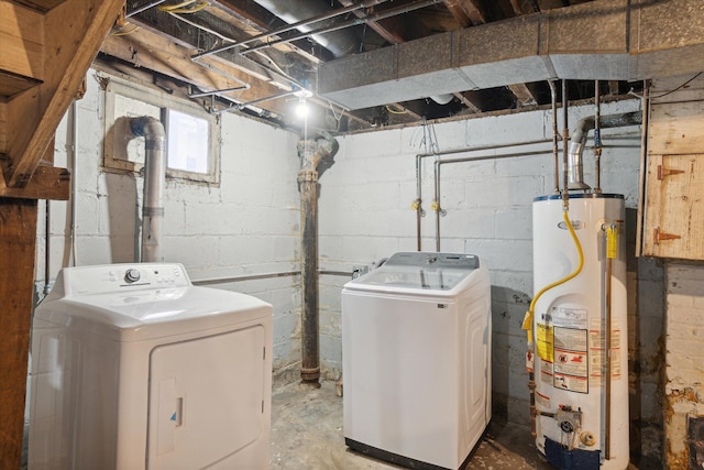 clothes washing area featuring washer and dryer and gas water heater