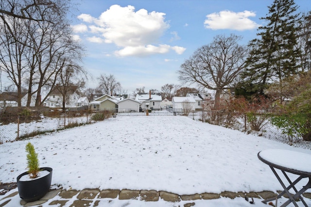 view of yard covered in snow